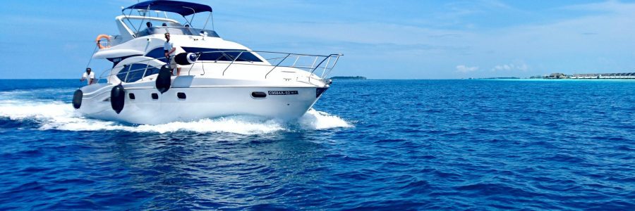 alina-kacharho-86wR5GZJZdQ-unsplash a white boat in the water