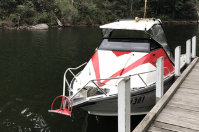 boat moored to floating dock