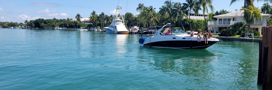 elena-o-2tPIHTNDkiw-unsplash people on a boat in the water