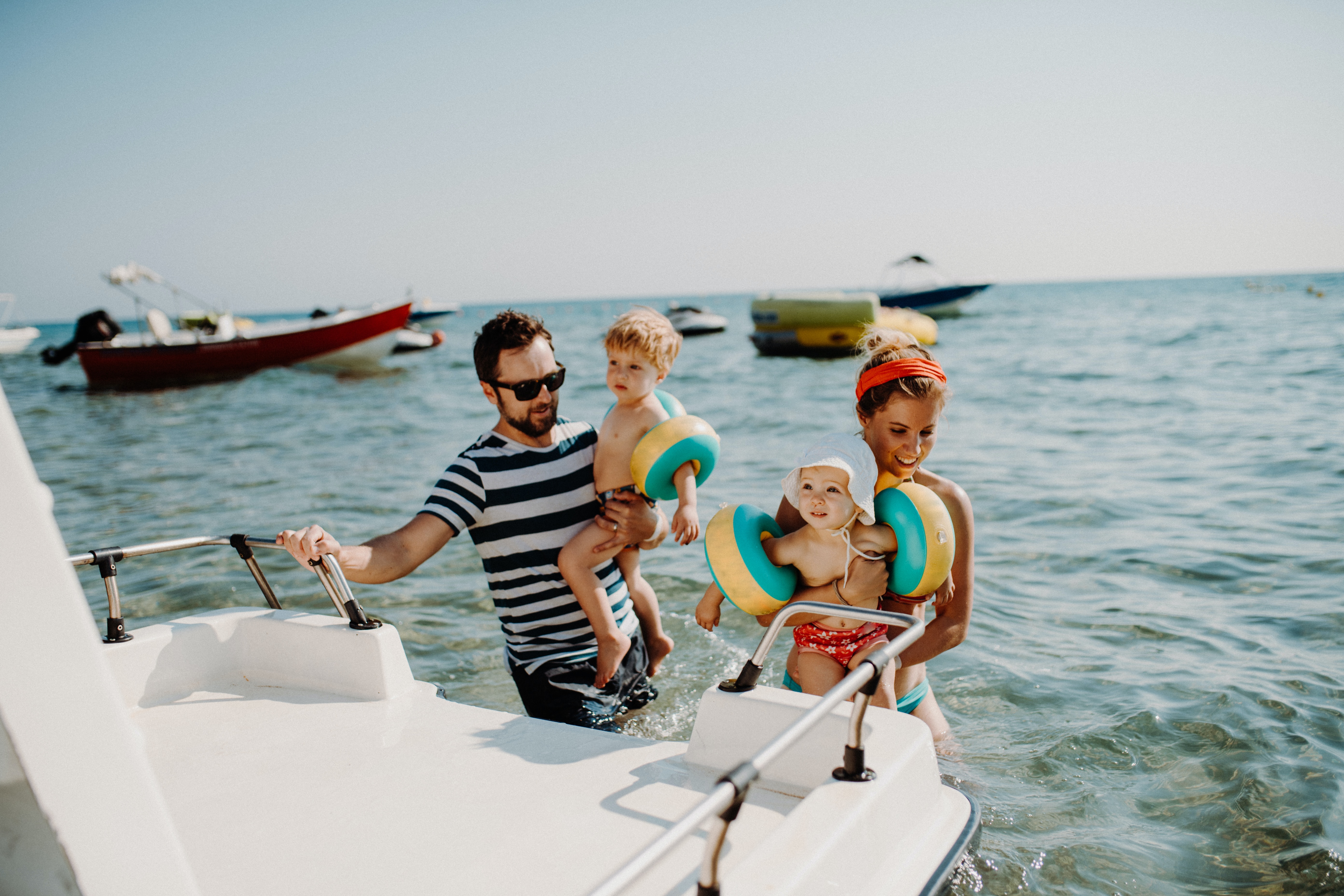 Male and Female with infant son and daughter on boat