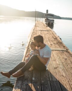 Dad and child on pier