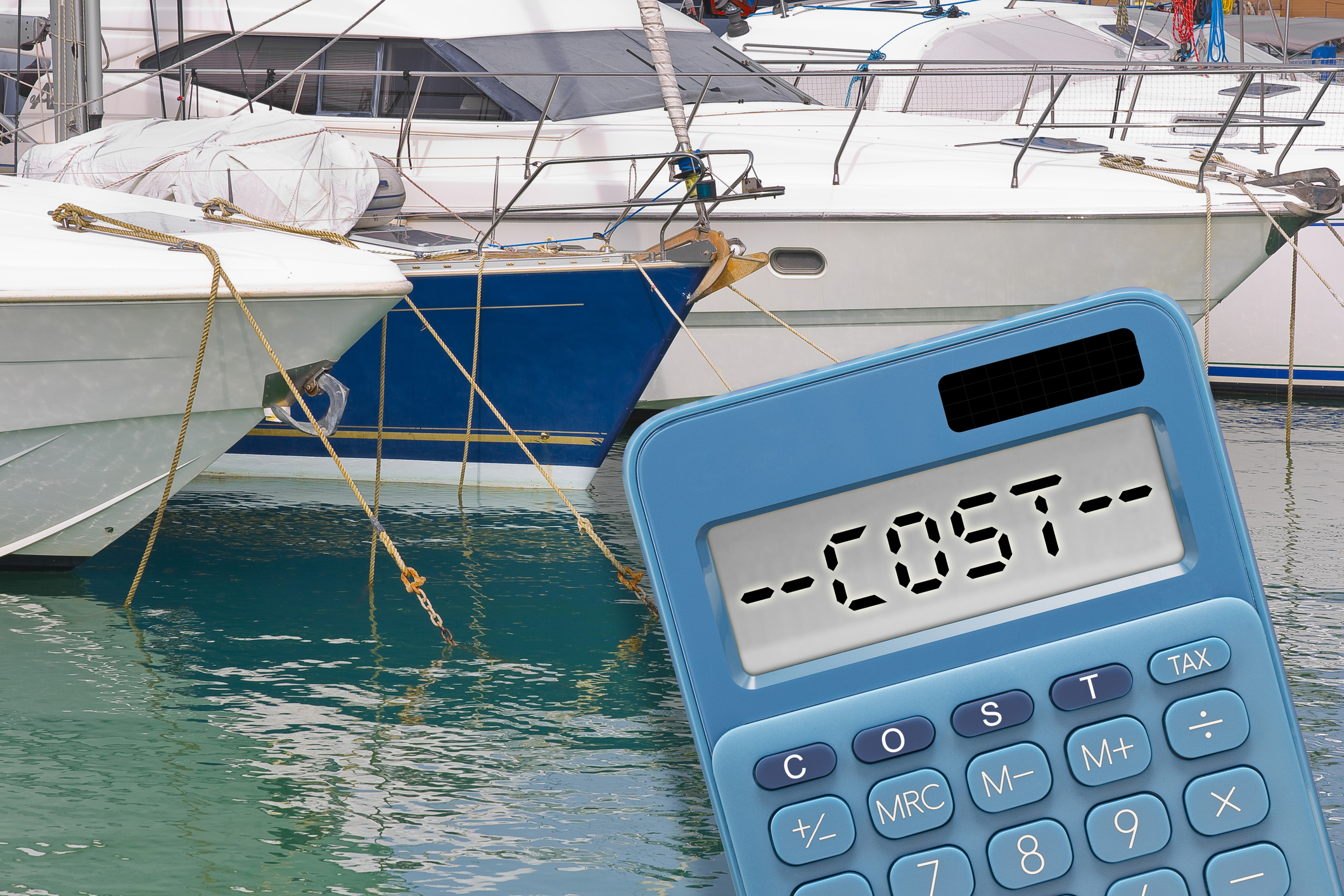 Boats In Background With Calculator in foreground showing "Costs"